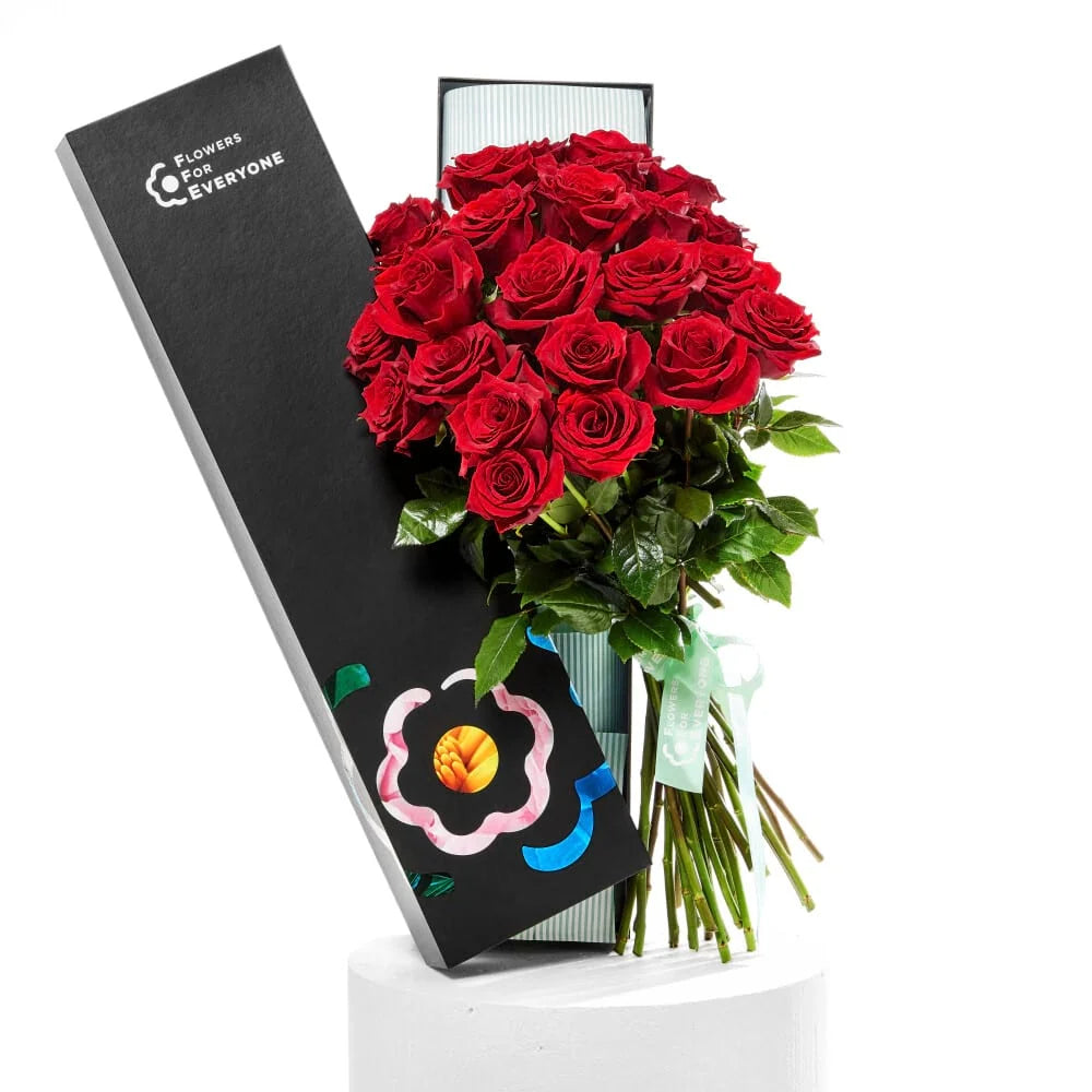 12 Red Rose Box featuring a lush bouquet of red roses in elegant black packaging for romance flowers and valentines flowers with same day delivery