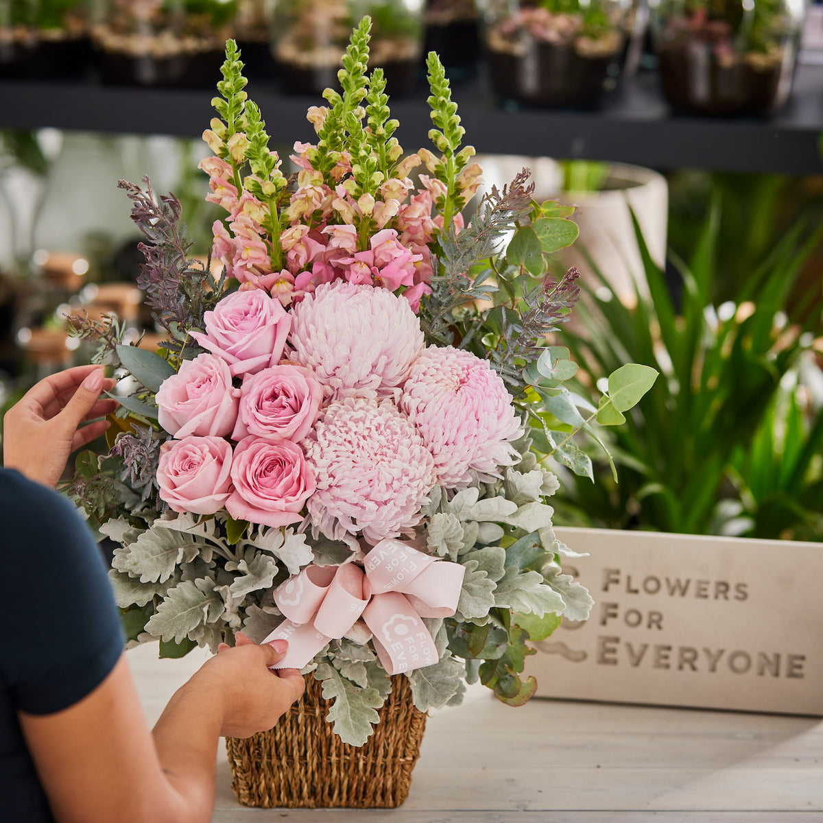 Precious Pink Basket with pink roses chrysanthemums snapdragons and eucalyptus for sympathy flowers and same day delivery from Flowers for Everyone