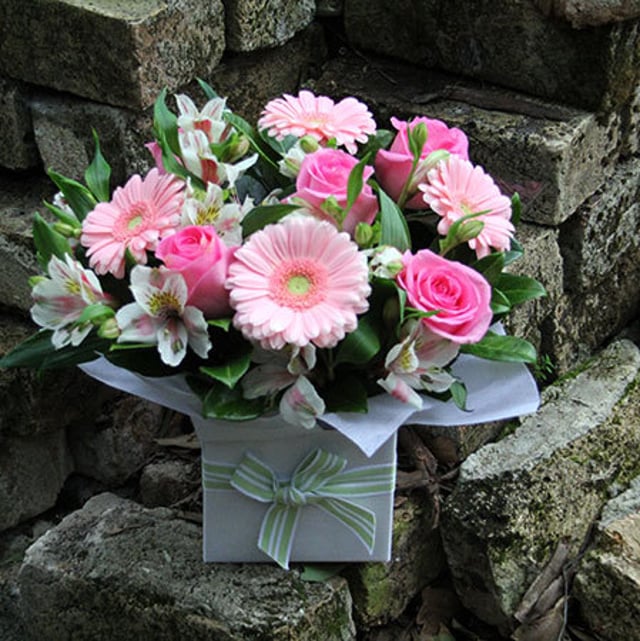 pink flower arrangement in box