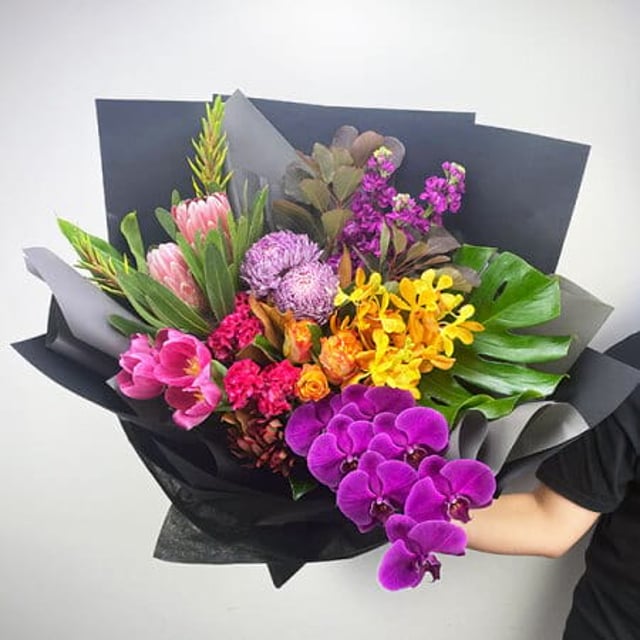 Bright Mothers Day Flowers with Tulips, Roses and Orchids