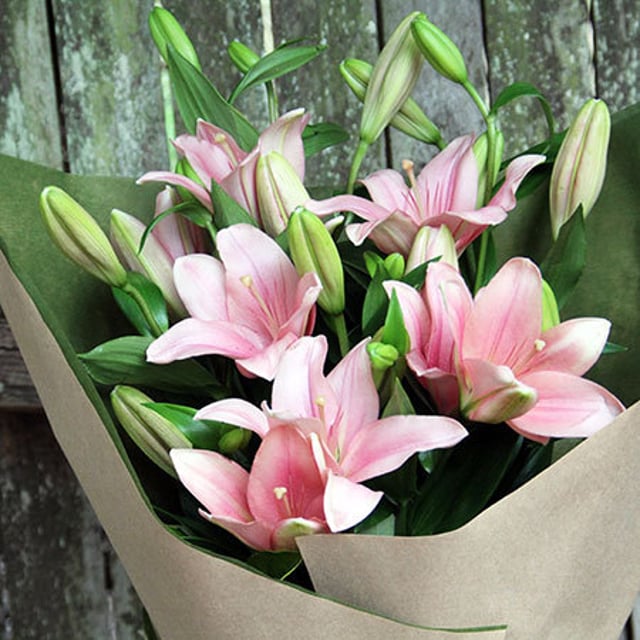 gift wrapped lily bouquet flowers delivered