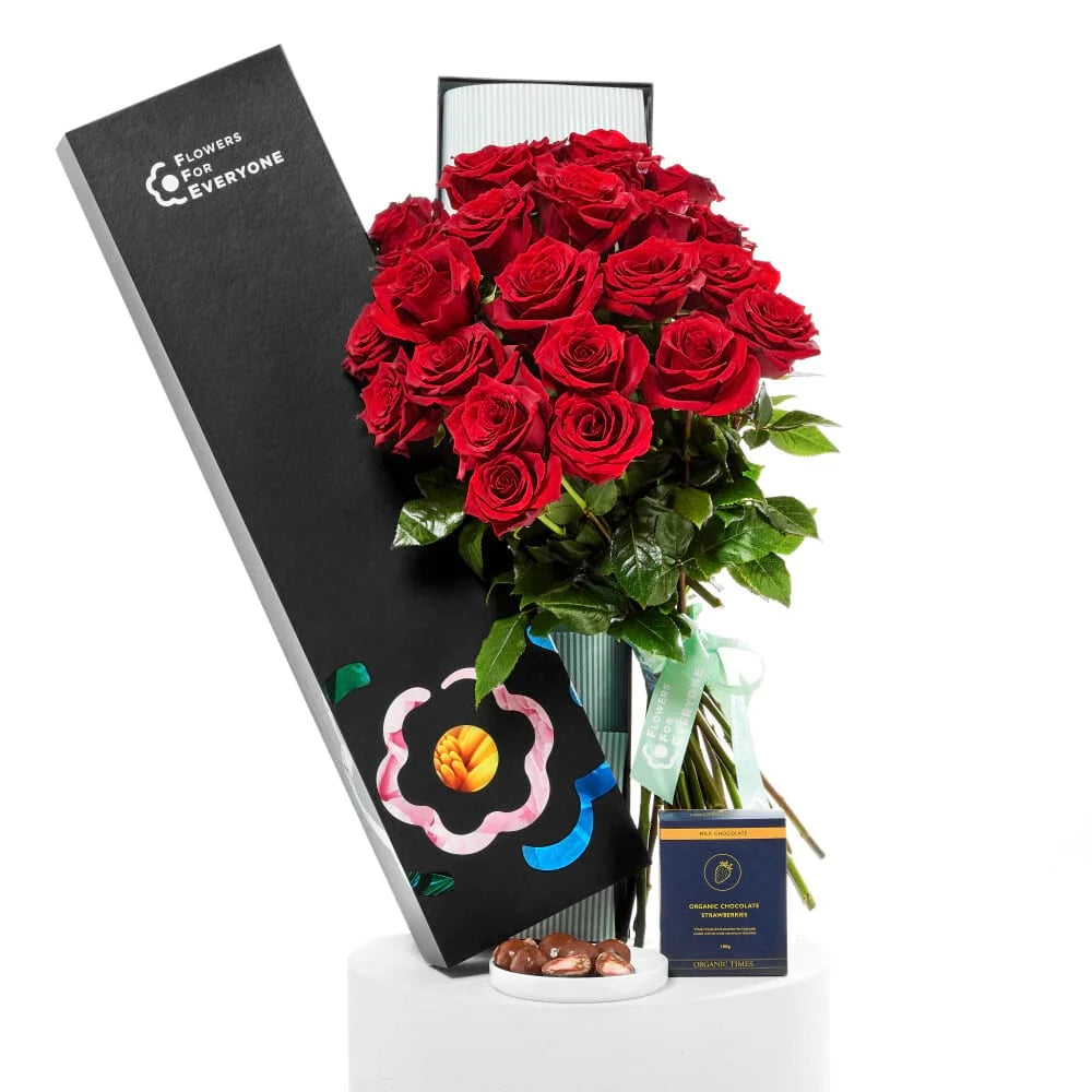 12 Red Roses with Strawberries arranged in a lush bouquet with elegant gift packaging for anniversary flowers and same-day delivery flowers