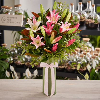 Pink Lily Queen Vase with fresh pink lilies lush greenery and a soft ribbon for birthday flowers anniversary flowers or same day delivery flowers