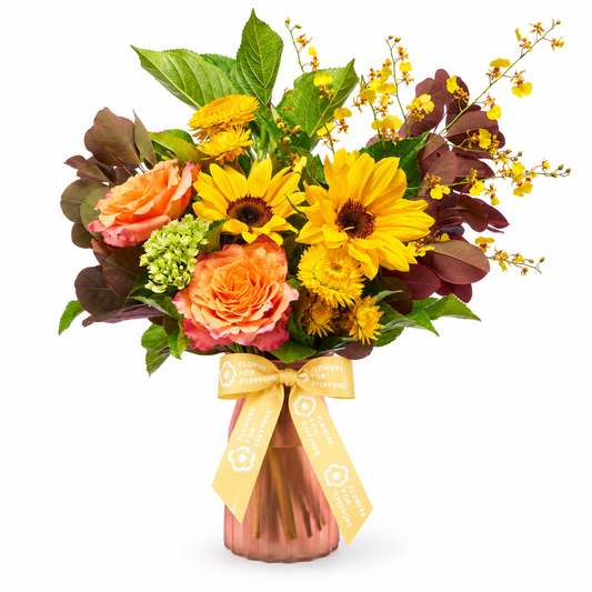 Hello You Flower Vase featuring bright sunflowers orange roses yellow blooms and lush foliage in a glass vase for same day delivery flowers