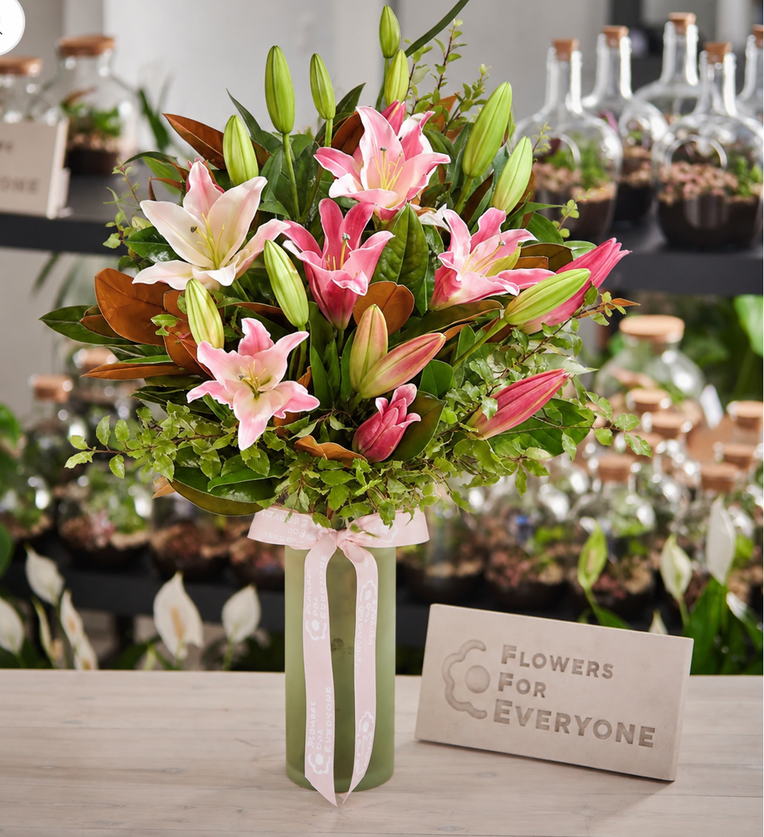 Pink Lily Queen Vase filled with fresh pink lilies lush greenery and soft ribbon for birthday flowers anniversary flowers or same day delivery flowers