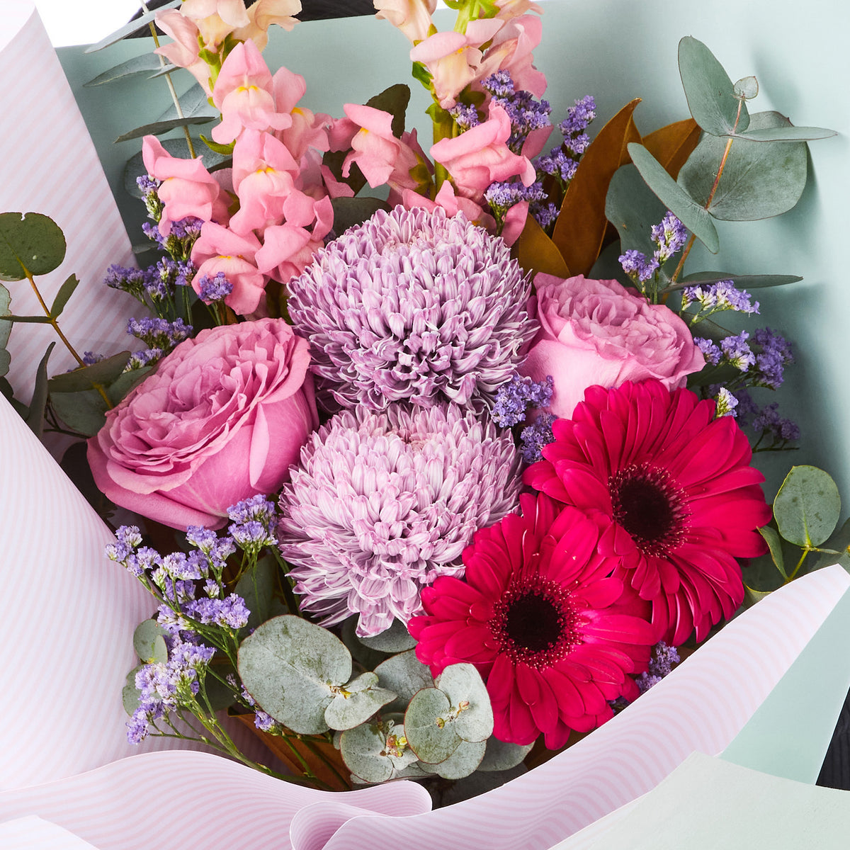 LAVANDER BLISS BOUQUET with pink roses chrysanthemums red gerberas purple filler and eucalyptus for birthday flowers graduation flowers and same-day delivery flowers