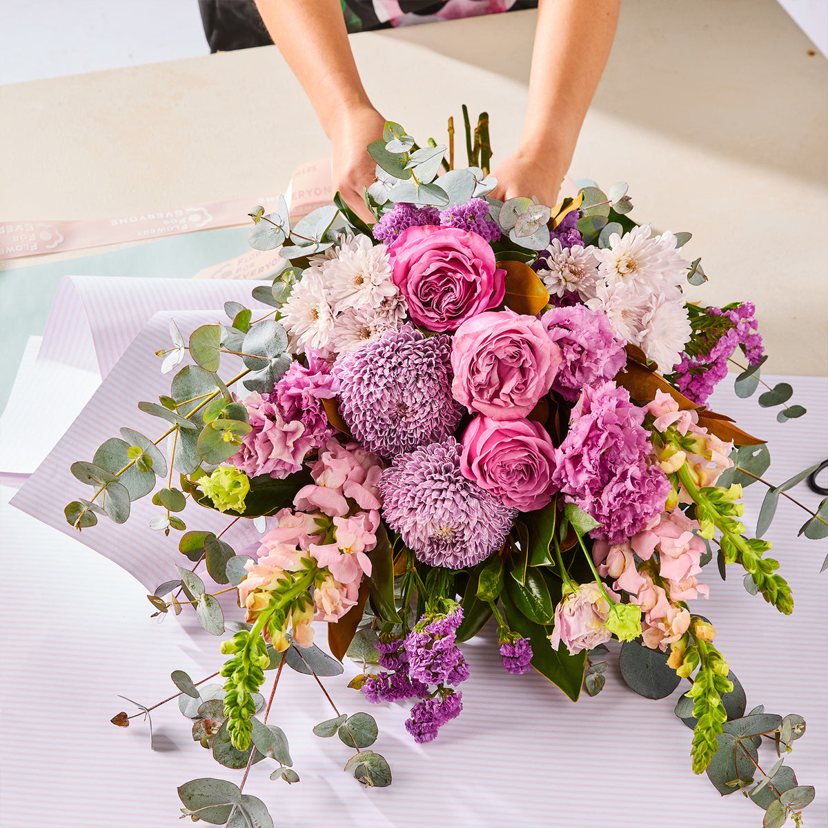 PURPLE PARADISE BOUQUET with pink roses chrysanthemums purple blooms and eucalyptus foliage for birthday flowers and same-day delivery flowers