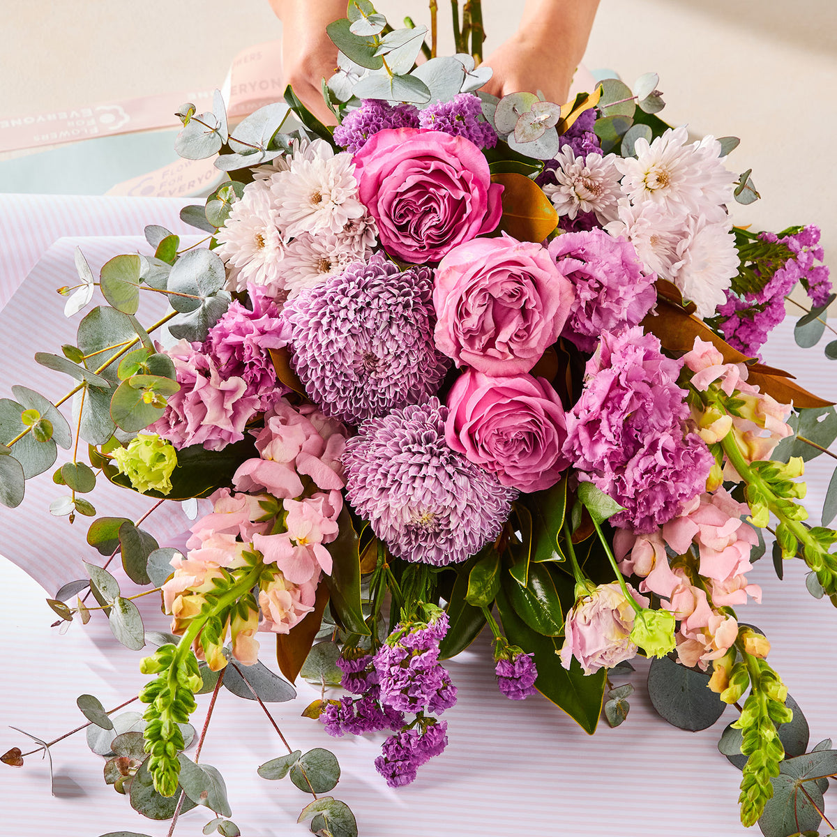 PURPLE PARADISE BOUQUET with pink roses purple chrysanthemums and eucalyptus foliage for birthday flowers graduation flowers and same day delivery flowers