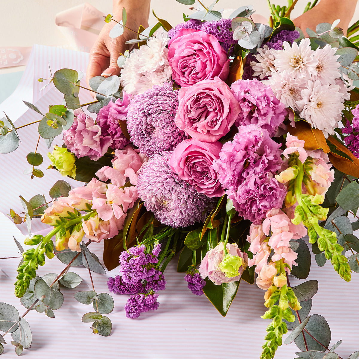 PURPLE PARADISE BOUQUET with pink roses purple chrysanthemums and eucalyptus foliage for birthday flowers graduation flowers and same-day delivery flowers