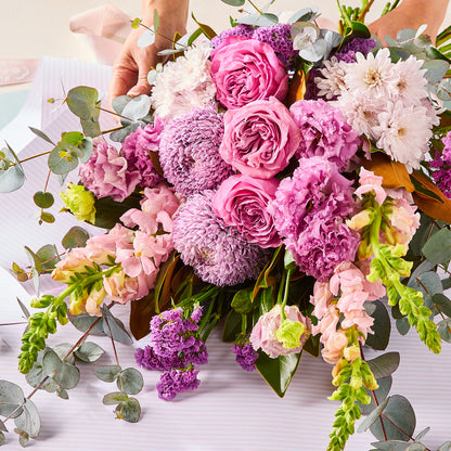 PURPLE PARADISE BOUQUET with pink roses purple chrysanthemums and eucalyptus foliage for birthday flowers graduation flowers and same-day delivery flowers