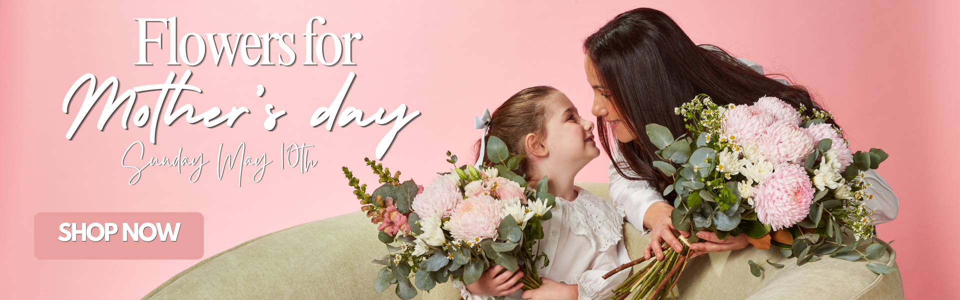 Mother and daughter enjoying Mother's Day flowers.