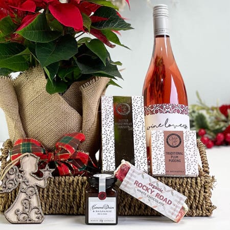Christmas gift basket with wine pudding poinsettia