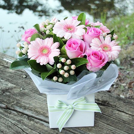 pink flower arrangement in box