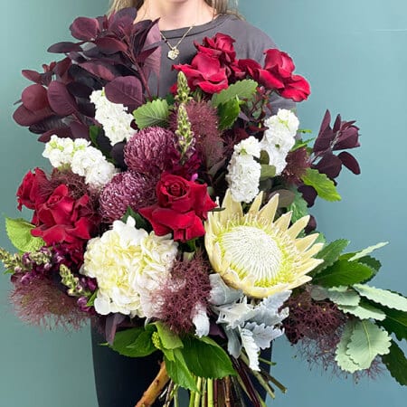 Lux Christmas Flowers with King Protea, Red Roses & Hydrangea