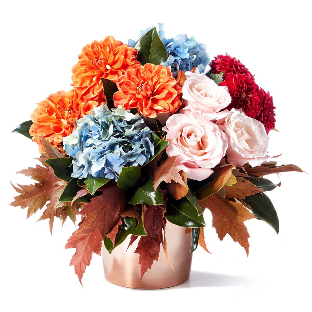 Saffron Spice: Copper Pot with Orange Dahlias, Roses & Blue Hydrangea